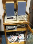 A TEAC HI-FI SYSTEM WITH SPEAKERS IN AN OAK CASE WITH CD'S ETC..