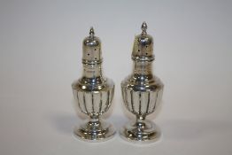 A PAIR OF HALLMARKED SILVER PEPPERETTES APPROX WEIGHT - 55G