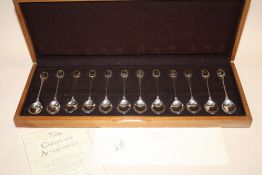 A BOXED SET OF TWELVE HALLMARKED SILVER RSPB SPOONS WITH CERTIFICATE