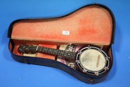 A 'THE WHIRL' BANJOLELE IN FITTED CASE