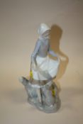A LLADRO FIGURE OF A LADY AND A RABBIT