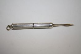 A HALLMARKED SILVER EXTENDING TOOTH PICK