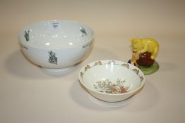 A ROYAL DOULTON WINNIE THE POOH 'ISN'T IT FUNNY HOW A BEAR LIKES HONEY' FIGURE TOGETHER WITH A