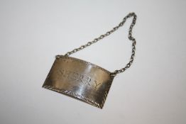 A HALLMARKED SILVER SHERRY DECANTER LABEL
