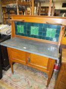AN ANTIQUE MARBLE TOPPED WASH STAND WITH TILED BACK W-99 CM A/F MARBLE HAS BEEN LACQUERED