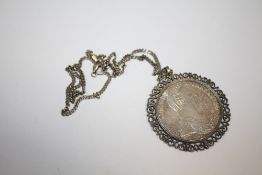 A COIN PENDANT ON SILVER CHAIN