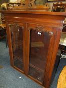 A VICTORIAN MAHOGANY GLAZED TWO DOOR BOOKCASE (OFF A BUREAU) H-122 W-107 CM