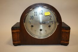 AN INLAID OAK MANTEL CLOCK, STRIKING ON BARS