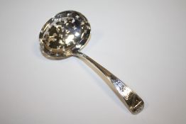 A HALLMARKED SILVER SIFTER SPOON