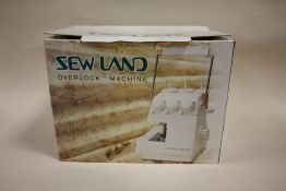 A BOXED SEW LAND OVERLOCK MACHINE