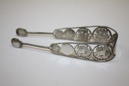 A PAIR OF ANTIQUE SILVER SUGAR TONGUES