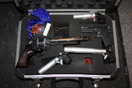 A HARD CASE CONTAINING CAP GUNS, NOVELTY BANG GUNS AND CAPS