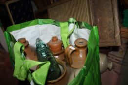 A COLLECTION OF VINTAGE STONEWARE TO INCLUDE FLAGONS, BOTTLES ETC. TOGETHER WITH A VINTAGE GLASS