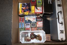 A BOX OF NOVELTY QUIZ GAMES, POKER SET ETC.