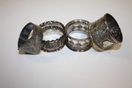 THREE HALLMARKED SILVER NAPKIN RINGS TOGETHER WITH ANOTHER