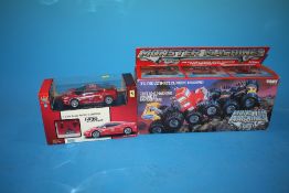 A BOXED MONSTER MACHINES CLIMBING MACHINE TOGETHER WITH A X-Q TOYS REMOTE CONTROL FERRARI