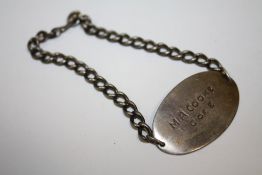 A WORLD WAR II SILVER ID BRACELET