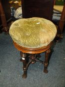 A WILLIAM IV MAHOGANY CIRCULAR ADJUSTABLE PIANO STOOL