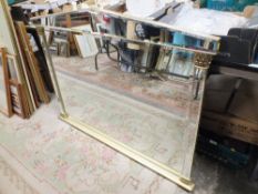 A LARGE OVERMANTLE MIRROR WITH MIRRORED FRAME