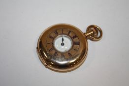 AN ANTIQUE ROLLED GOLD HALF HUNTER FOB WATCH