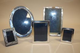 A COLLECTION OF FIVE SILVER PICTURE FRAMES