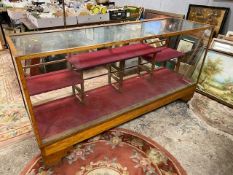 A LARGE VINTAGE OAK FRAMED GLAZED HABERDASHERS CABINET - NO DRAWERS H-91 W-58 L-178 CM