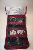A ROLL BAG OF ASSORTED COSTUME JEWELLERY