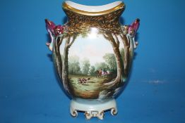 A HAND PAINTED TWIN HANDLED CERAMIC VASE DECORATED WITH A HUNTING SCENE