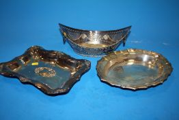 A SILVER PLATED MARQUEE SHAPED PIERCED TWIN HANDLED BASKET TOGETHER WITH TWO SILVER PLATED TRAYS (