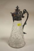 A SILVER PLATED CUT GLASS CLARET JUG