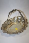 A HALLMARKED SILVER SWING HANDLED FLORALLY EMBOSSED BASKET APPROX WEIGHT - 393.3G