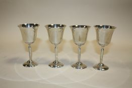 A SET OF FOUR HALLMARKED SILVER GOBLETS