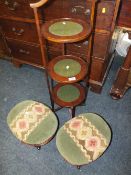 A SLENDER MAHOGANY 3 TIER DUMB WAITER AND 2 MAHOGANY TAPESTRY FOOTSTOOLS (3)