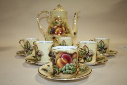 AN AYNSLEY ORCHARD GOLD COFFEE POT AND SET OF SIX AYNSLEY ORCHARD GOLD COFFEE CUPS AND SAUCERS
