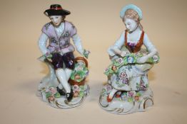 A PAIR OF CONTINENTAL STYLE CERAMIC FIGURES