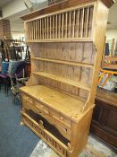 A PINE KITCHEN DRESSER WITH THREE DRAWERS H-204 W-126 CM