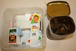A BOX OF THE SUN SOCCER CARDS TOGETHER WITH A TIN OF COINS