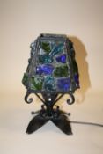 A CAST METAL TABLE LAMP WITH MULTICOLOURED GLASS SHARD SHADE