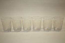 A SET OF SIX FLORALLY ETCHED DRINKING GLASSES