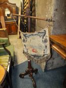 A WILLIAM IV ROSEWOOD POLE SCREEN WITH NEEDLEPOINT PENNANT SCREEN S/D