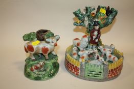 TWO STAFFORDSHIRE STYLE FIGURE GROUP VASES