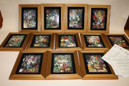 A SET OF TWELVE FRAMED COALPORT MARIANNE NORTH'S FLORAL GALLERY LIMITED EDITION CERAMIC PLAQUES,