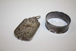 AN ANTIQUE SILVER CHATELAINE LOCKET BY GEORGE UNITE TOGETHER WITH A CHARLES HORNER SILVER NAPKIN