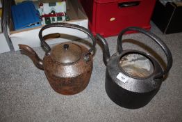 TWO VINTAGE CAST METAL KETTLES