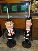 A PAIR OF UNUSUAL 'STAN LAUREL AND OLIVER HARDY' FIGURATIVE TOILET ROLL HOLDERS (2)