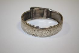 AN ANTIQUE ENGRAVED STERLING SILVER BANGLE