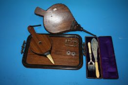 AN EBONISED OAK TWIN HANDLED SERVING TRAY TOGETHER WITH TWO SETS OF BELLOWS, FISH SERVERS ETC.