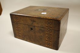 AN ANTIQUE INLAID WALNUT WORKBOX WITH MOTHER OF PEARL CARTOUCHE
