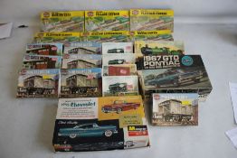 EIGHTEEN BOXED OO GAUGE RAILWAY AIRFIX KITS OF TANKS, WAGONS, BUILDINGS ETC. and Airfix Pontiac 1/24