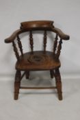 A CHILDS COMMODE CHAIR, in the style of a smokers bow chair